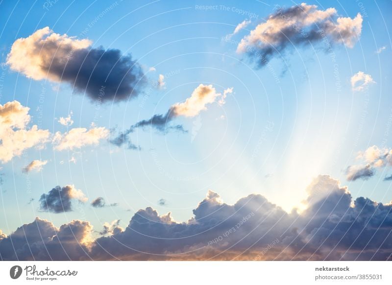 Cloudscape with Sunlight Rays Behind Clouds sky ray beam cloudscape sunny weather cumulus blue white beaming no people nobody good weather sunlight