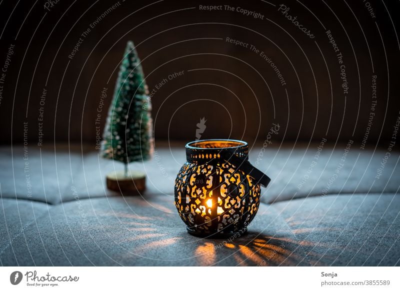 A rustic lantern with candlelight Lantern Black Dark Night Visual spectacle Orange Christmas & Advent Evening Candlelight shoulder stand Flame Warmth Burn