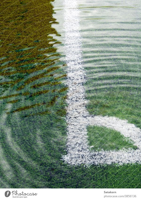 Flooding in artificial grass football field water flood game soccer white line black green sport environment leisure activity wet exercise background rain