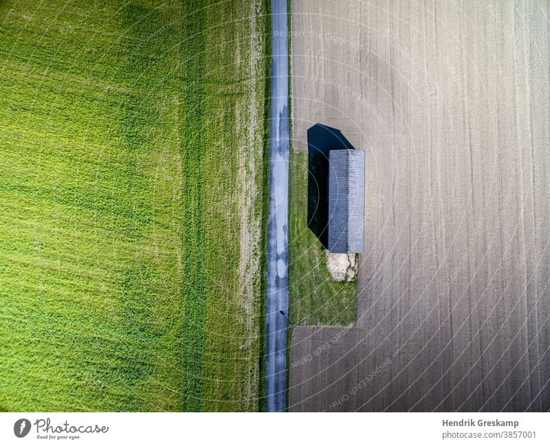 agricultural hut photographed from the air corn soil farmer light grassy line harvest farming green harvester farmland outdoors day road earth parallel