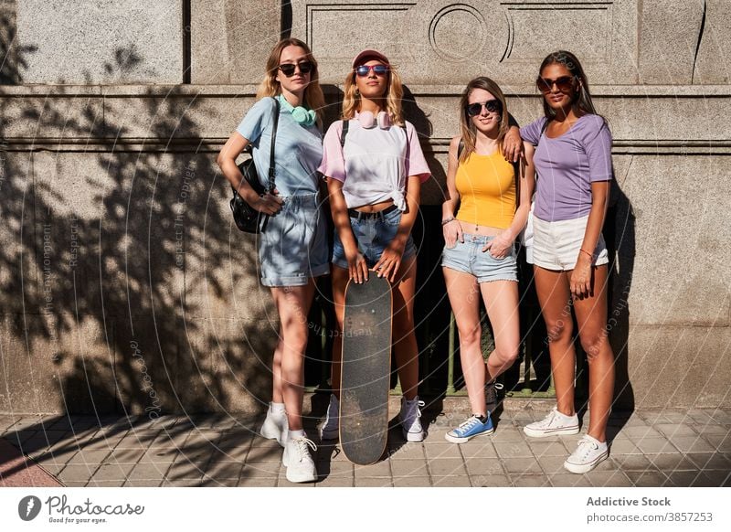 Trendy young women with skateboard in city friend group urban trendy together happy teenage cheerful girl sunglasses longboard girlfriend cool millennial skater