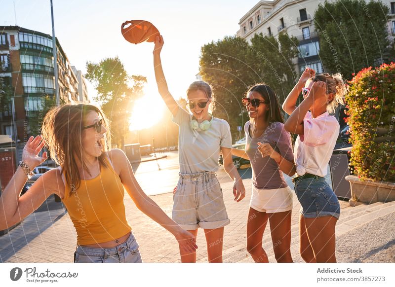 Group of cheerful teenagers dancing on street girlfriend having fun group city dance carefree summer happy together diverse multiethnic multiracial female