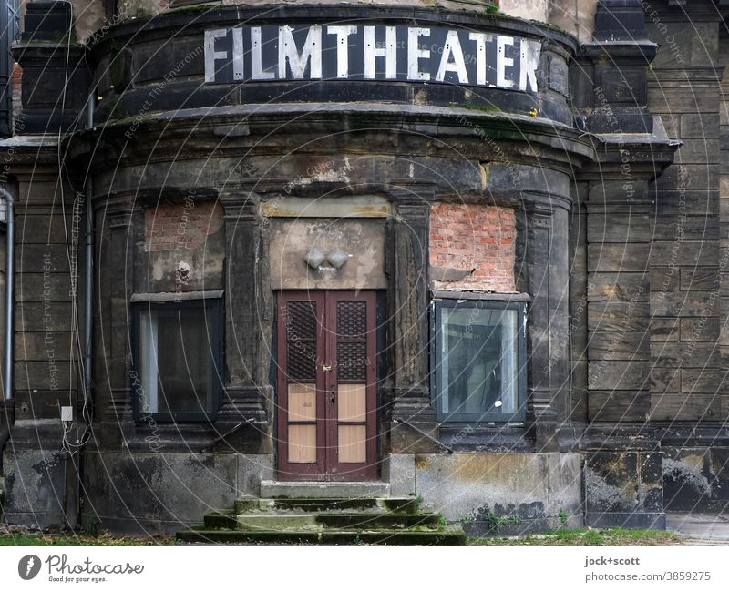 obvious decline of the age of the film theatre Past Ruin Entrance in need of rehabilitation Downfall Historic Decline lost places Architecture Change