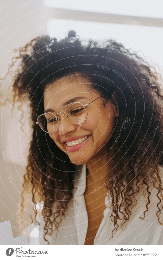 Smiling black businesswoman working in office entrepreneur determine document paperwork serious confident workplace female ethnic african american bright happy