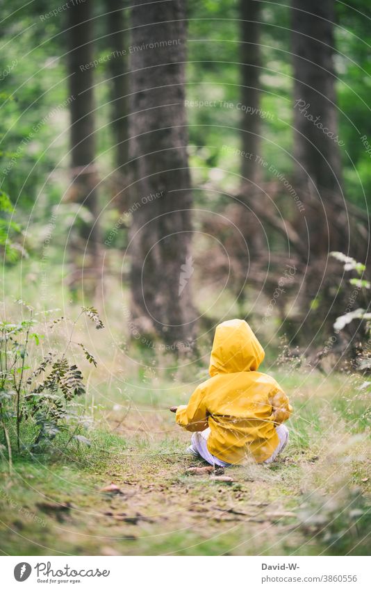Child sitting on the forest floor in the forest Forest Woodground Nature nature boy friesennerz Environment trees Toddler Sustainability