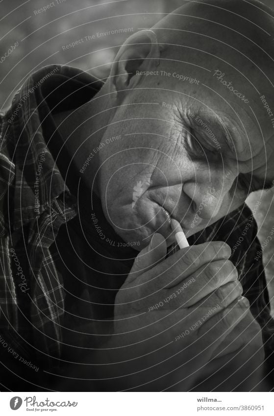 Portrait of a smoker Man Smoking smoking Cigarette Ignite portrait Face Addiction enjoyment relaxation habit Dependence Nicotine Health hazard