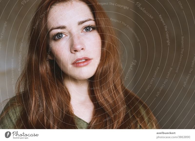 young woman in empty room with natural light real people portrait Young woman naturally Dreamily Red-haired Woman Adults Long-haired Freckles