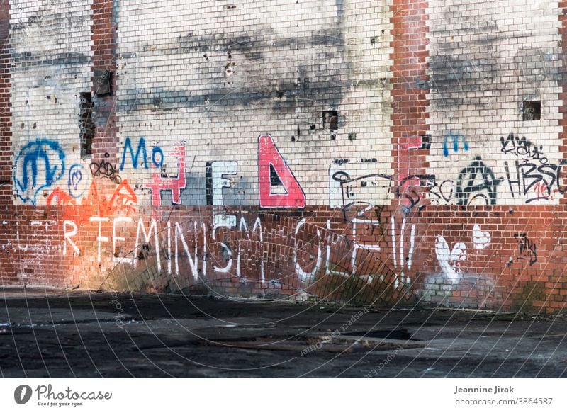 Feminism in brick - Beelitz Heilstätten writing Letters (alphabet) Wall graffiti Graffiti Deserted Colour photo Facade femininity Wall (barrier) Typography Text