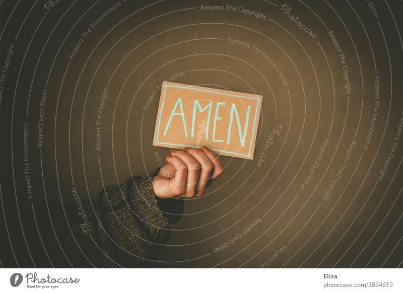 Person holds a sign with the inscription Amen amen Church Heart Prayer pray Religion and faith religion Christianity Judaism praying Love Belief believe Holy
