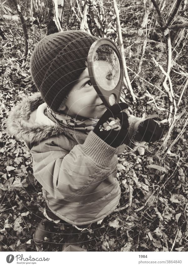 Child discovers the world with magnifying glass #childhood Light heartedness Joy Playing Exterior shot Happiness Happy 3 - 8 years Discover Infancy