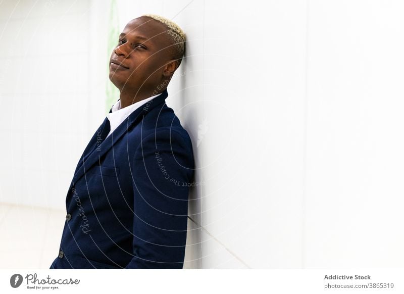 Black businessman in formal outfit in hallway confident suit well dressed costume entrepreneur corridor professional style male ethnic black african american