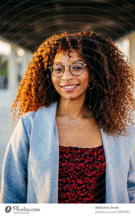 Stylish ethnic female in roofed passage woman street city rest style outfit smile modern young urban trendy black african american curly hair glasses town