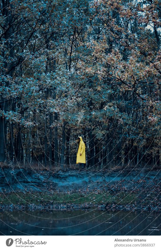 Guy in a yellow jacket in the forest near a lake Yellow Forest Jacket walk Lake Moody Dark