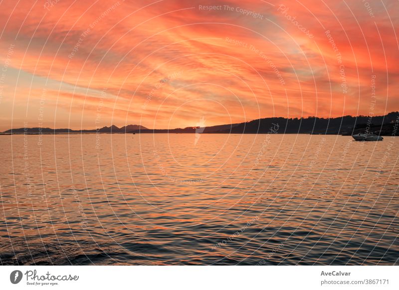 Horizon of some islands under a colorful sunset with a relaxing seascape ocean tide wave sunrise gold surf abstract dawn australia colour colourful dream glow