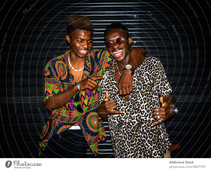 Happy black men on street friend greeting cheerful friendship young city night ethnic african american gesture meeting happy together modern smile toothy smile