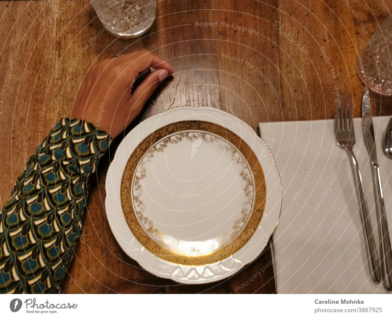 The arm of a woman on the laid table, waiting for the meal. Table Glass Living or residing Design Style Colour photo Life Nutrition Plate Porcelain Cutlery