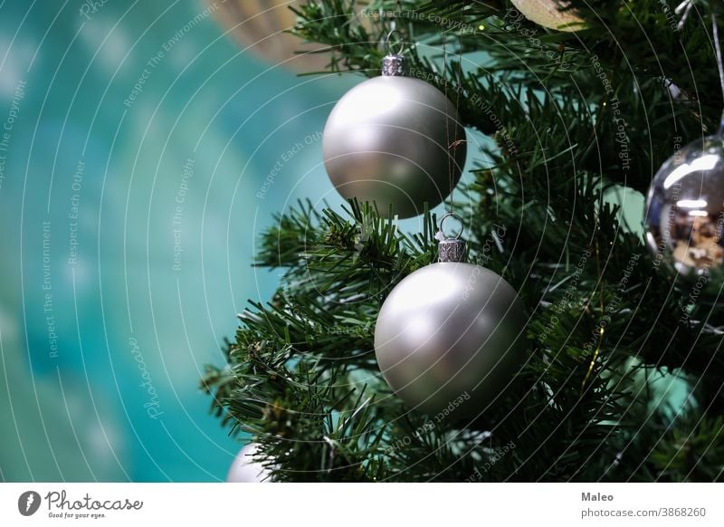Silver balls hang on the Christmas tree christmas hanging silver decoration white xmas background holiday celebration glass ornament winter green isolated