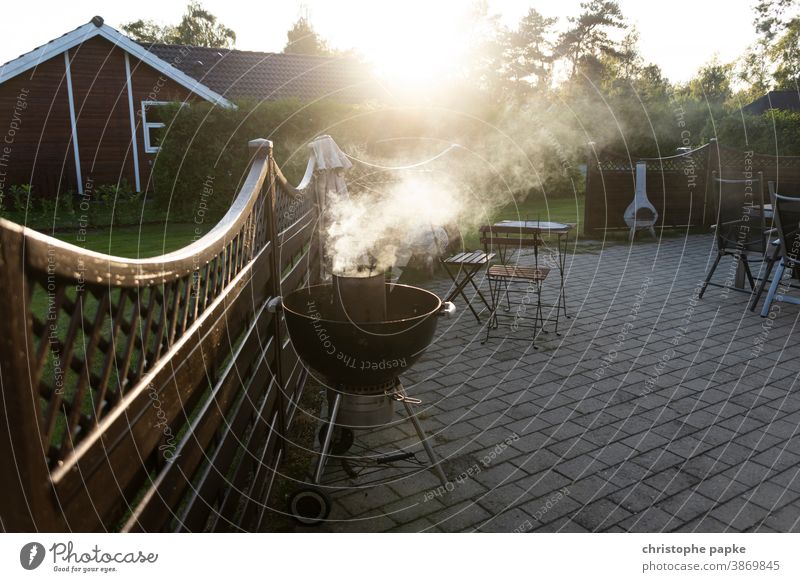 Grill is lit Barbecue (apparatus) BBQ Ignite terrace Smoke Evening kettle grill Summer vacation Denmark BBQ season Fire Deserted Nutrition Exterior shot