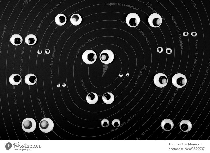 several eye couples on black background angry art cartoon character circle curve cute design different element emotion expression eyeball eyesight face funny