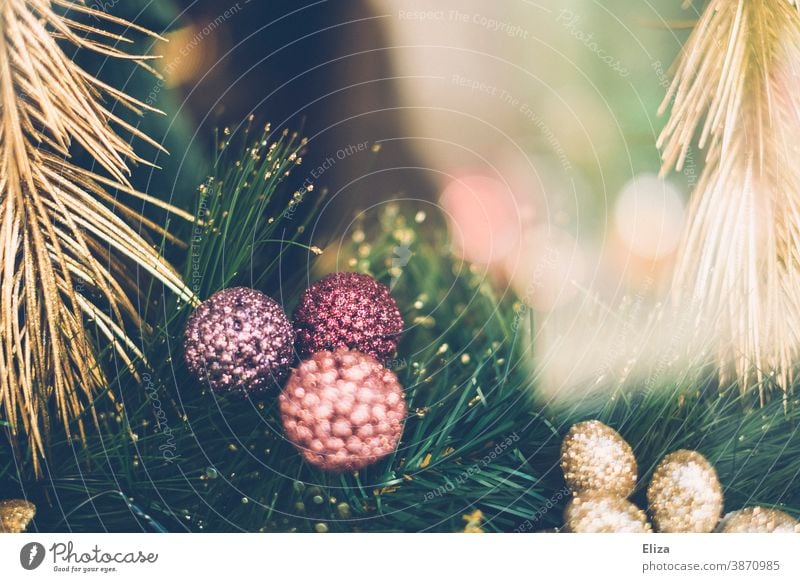 Glittering golden and pastel-coloured Christmas decoration baubles fir branches glittering pastel shades pink purple pretty Christmas & Advent
