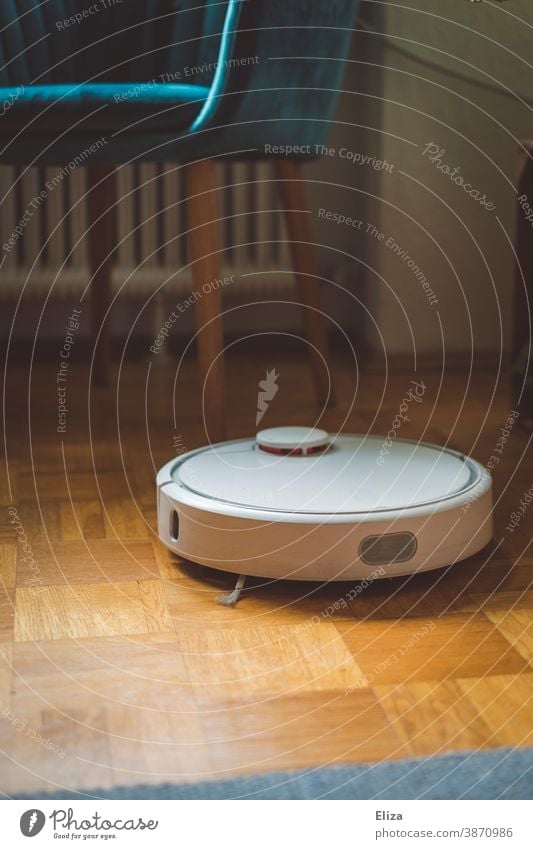 A robot vacuum cleaner cleans the apartment diligently and independently and makes household chores easier Vacuum cleaner robot Robot Household Vacuuming