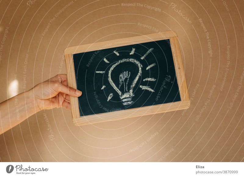 A light bulb painted on a blackboard. concept have an idea. Idea Creativity Electric bulb solution Inspiration Think innovation Innovative creatively