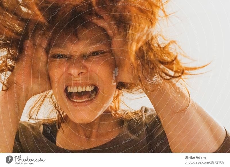 The Corona scream - woman pulls her hair, covers her ears and screams out her desperation Woman corona Anger Distress faint Scream ears to hold hair pulling