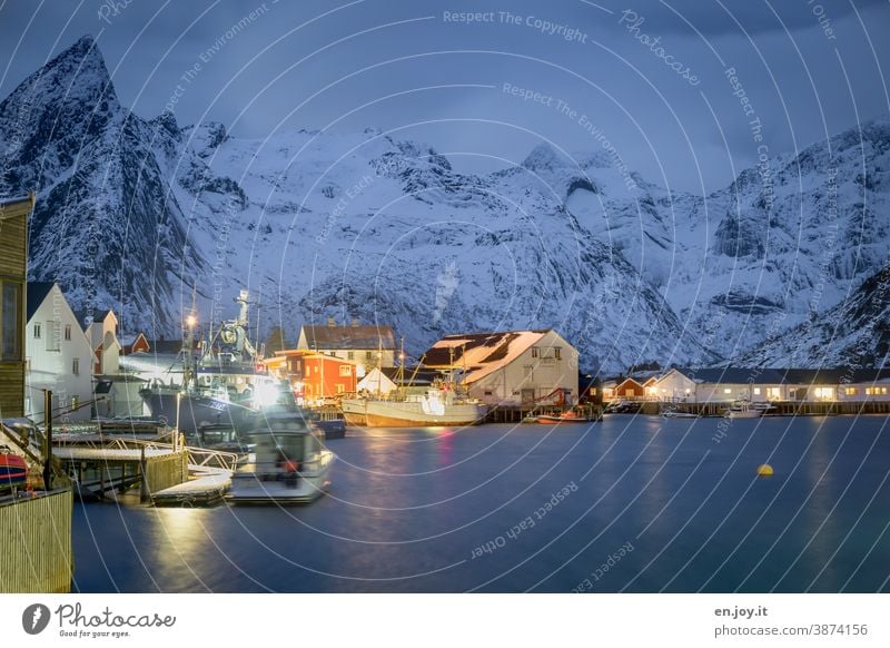 Blue hour in the port of Hamnoy on the Lofoten Lofotes hamnoy Norway Scandinavia Harbour North Meadow Snow Cold Mountain Snowcapped peak blue hour Evening