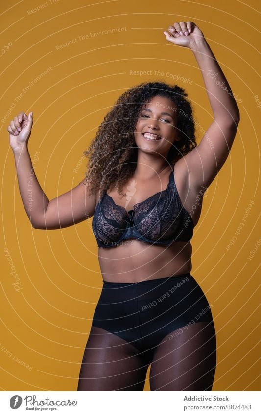 Attractive happy chubby ethnic woman in stylish lingerie fashion underwear plus size style lace elegant feminine plump female model african american black