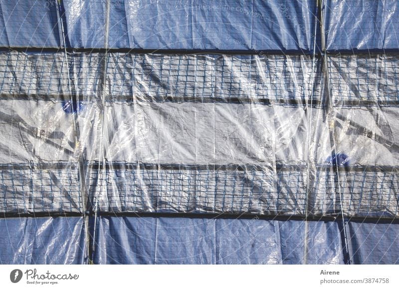 Tarpaulin lashed Construction site tarpaulin fixed sealed tight Scaffolding Shadow seal off Screening Protection Safety secure impenetrable obstructed too