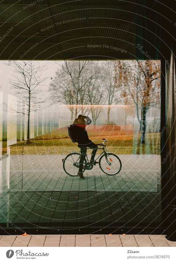 Self portrait of a photographer on a bicycle Bicycle Cycling Photographer Take a photo Mirror Slice Window Nature reflection Autumn trees warm colors Young man