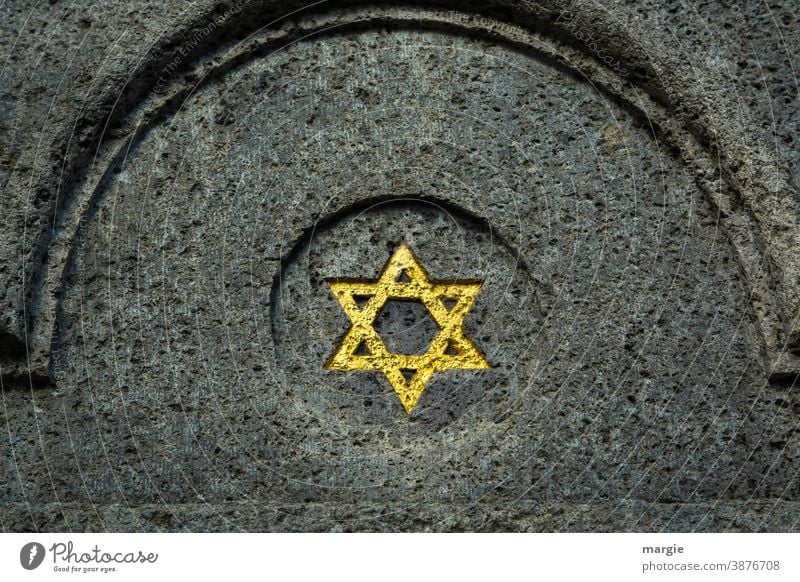 A golden Star of David on a building Israel Building Grave Monument Building stone Religion and faith Landmark Manmade structures Tourist Attraction Historic