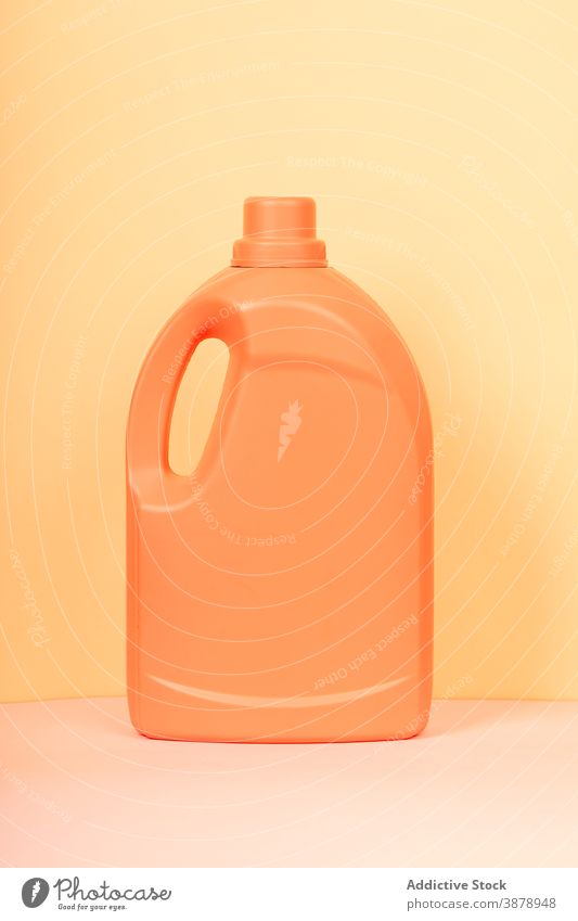 Plastic bottle from detergent on yellow background plastic cleanse hygiene container liquid product household housework studio vivid vibrant color bright