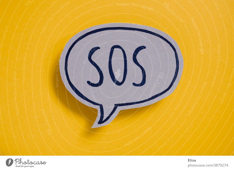 Speech bubble with the word SOS on yellow background Help Emergency call ask for help Rescue peril Emergency situation Cry for help Word authored Yellow