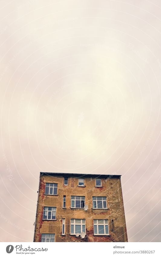 solitary, old apartment building with large windows and satellite dishes Apartment Building dwell Window Satellite Dish Sky Old dilapidated Architecture Facade
