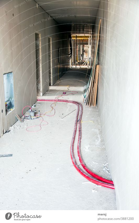 The red thread is always important on such a large construction site Construction site Pink Transmission lines Water pipe Cable Workplace Wall (building) Change