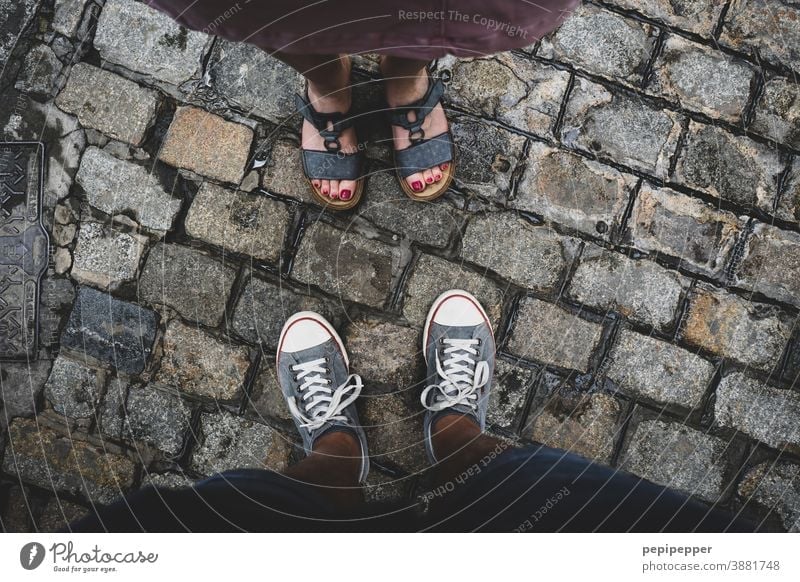 Man and woman photographed from above on feet Feet up Human being Exterior shot Vacation & Travel Colour photo Toes Footwear Sandals Sneakers sneakers