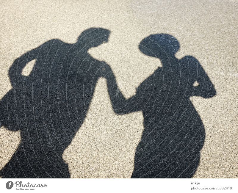 undressed shadow with hat and sunglasses Colour photo Shadow Silhouette Beach Tourism Sun vacation Couple at the same time NUDISM Copy Space Anonymous Touch Man