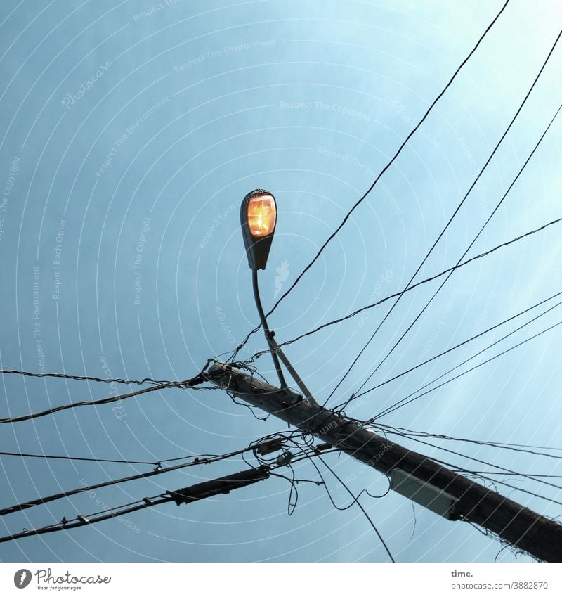 light boxes (24) Lamp Sky streetlamp sunny Construction Suspension Lighting Tall Above Worm's-eye view Cable Electricity pylon transmission line Whimsical