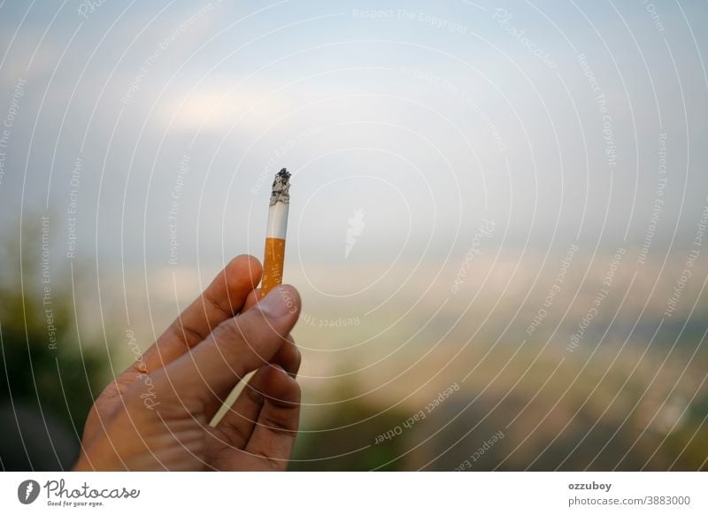hand holding cigarette person human finger addiction habit tobacco arm isolated smoke stop unhealthy white adult nicotine background closeup thumb destroy male