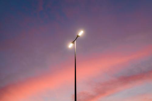 View of the streetlight in a beautiful sunset sky abstract background blue bright cloud clouds cloudscape color colorful dawn design dusk electrical electricity