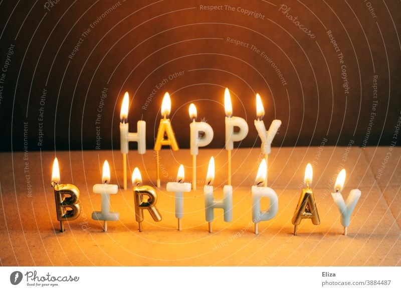 Burning Happy Birthday candles cauterizing shoulder stand birthday candles lettering writing