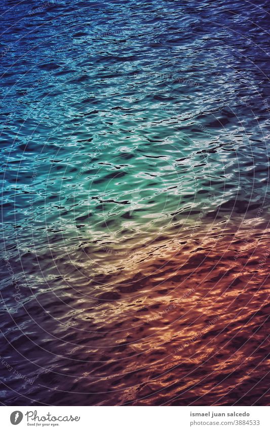 sunset reflected on the water sea ocean reflection light bright liquid sunlight multi colored multicolored colorful colors abstract textured background pattern