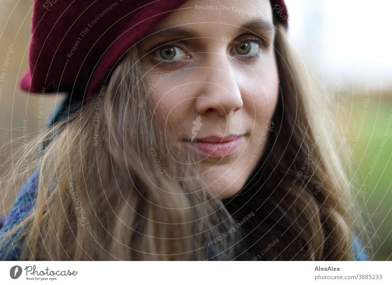 Close portrait of a young woman with hat Woman Slim pretty Brunette long hairs Face smart emotionally see look Looking Direct naturally Fair-skinned pale