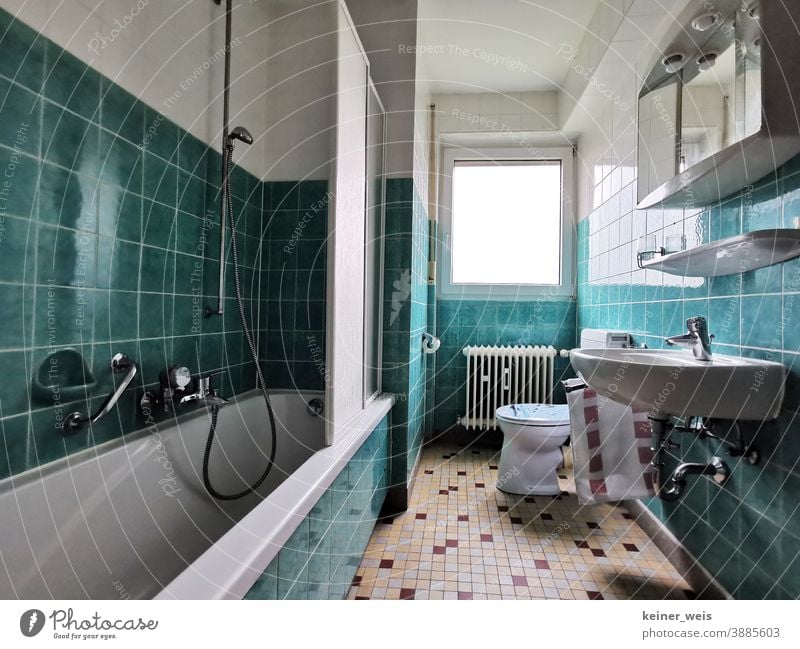 Beautiful living in the bathroom with green and white in your rental apartment Green Tile floor tiles installation Craft (trade) Shower partition Toilet
