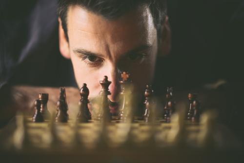 Man plays chess Prospect of success Success strategy concept planning Safety Playing challenge Chess Chessboard Intellect Think strategist Ambitious Duel