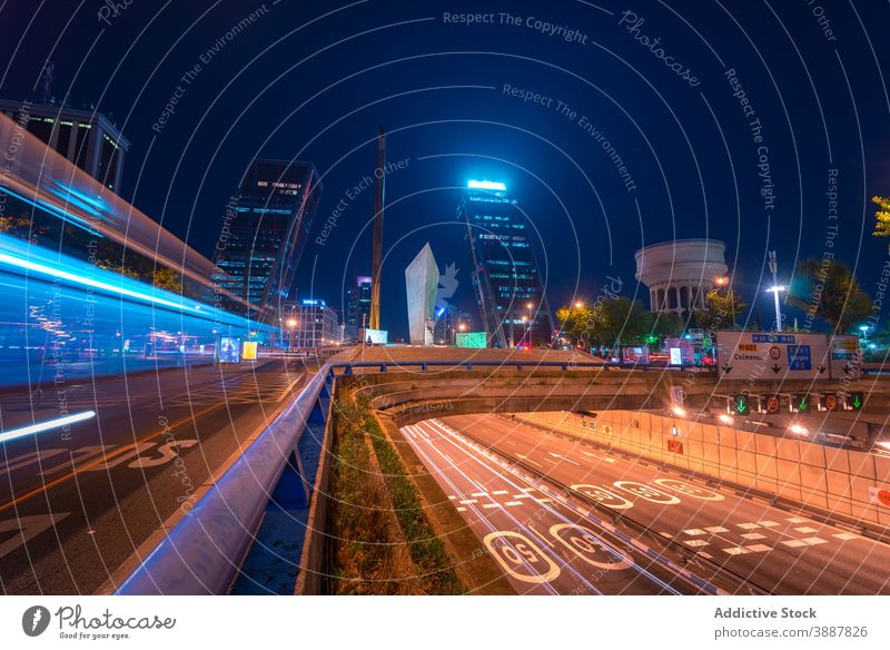 City roads with light at night traffic trail headlight city evening line speed madrid spain blue color urban asphalt magnificent megalopolis illuminate route