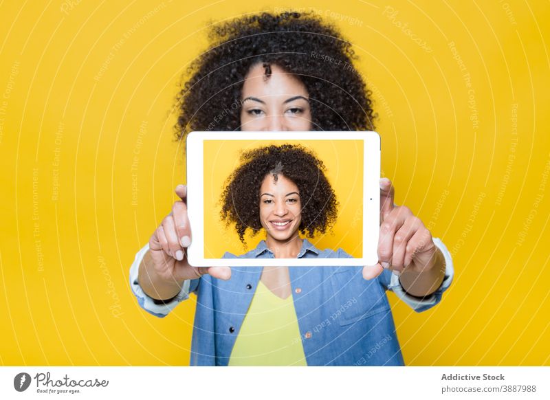 Cheerful black woman taking selfie with tablet screen take photo cheerful happy digital gadget using device young african american ethnic hipster smile