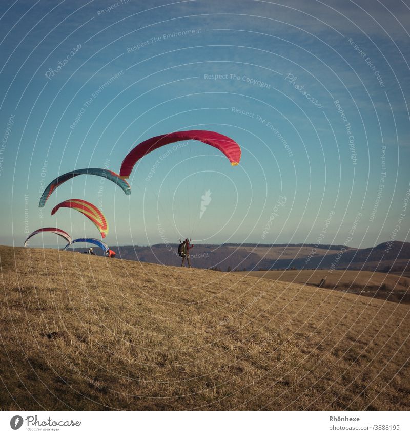 Paragliders in the cold winter air at the Wasserkuppe Flying Colour photo Sports Above Sky Multicoloured Exterior shot Leisure and hobbies Freedom Day