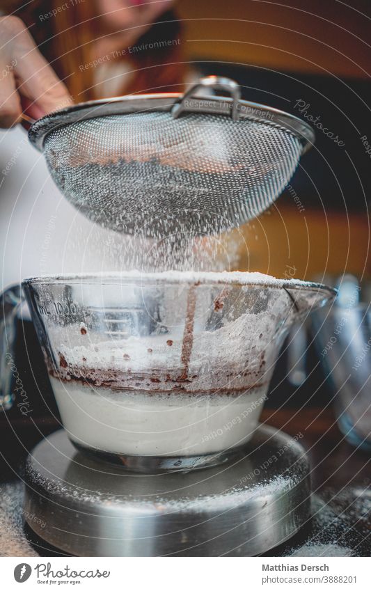 In the Christmas bakery Confectioner`s sugar Flour Baking Baking at home Sieve bowl Detail